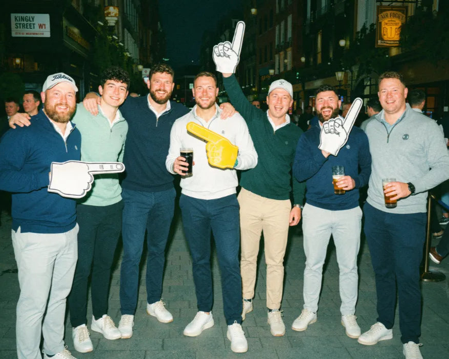 Friends playing pub golf together on a night out