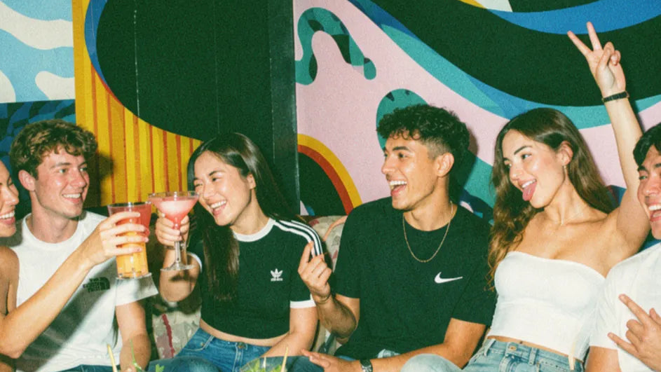 Group of friends on a student night out playing pub golf