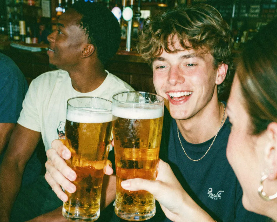 A pub golf player with a drink at a pub table