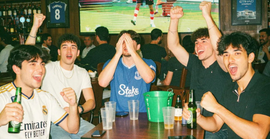 Group of friends laughing together while playing pub golf on a night out