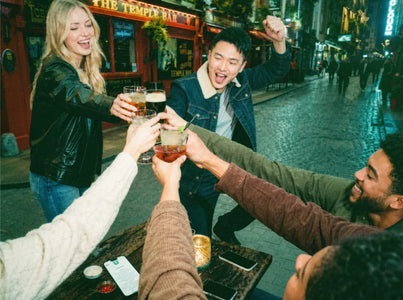 Group of friends toasting in a pub on a pub golf night out