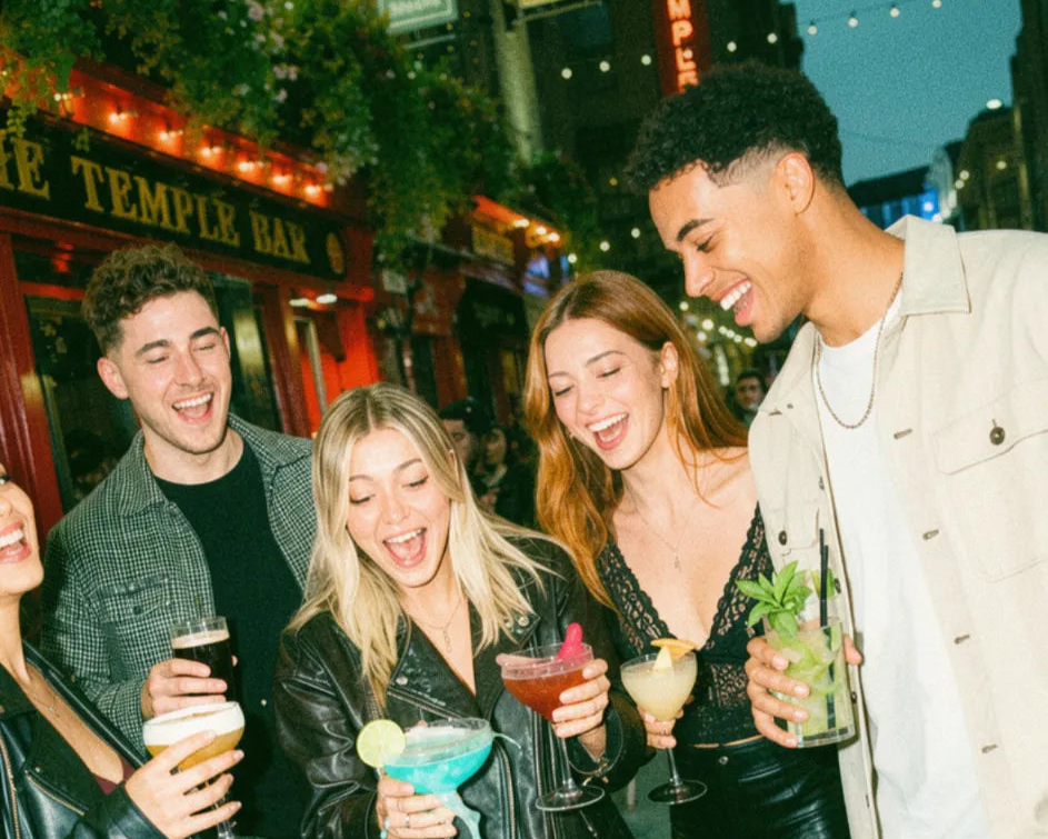 Friends on a pub crawl between bars during a pub golf game