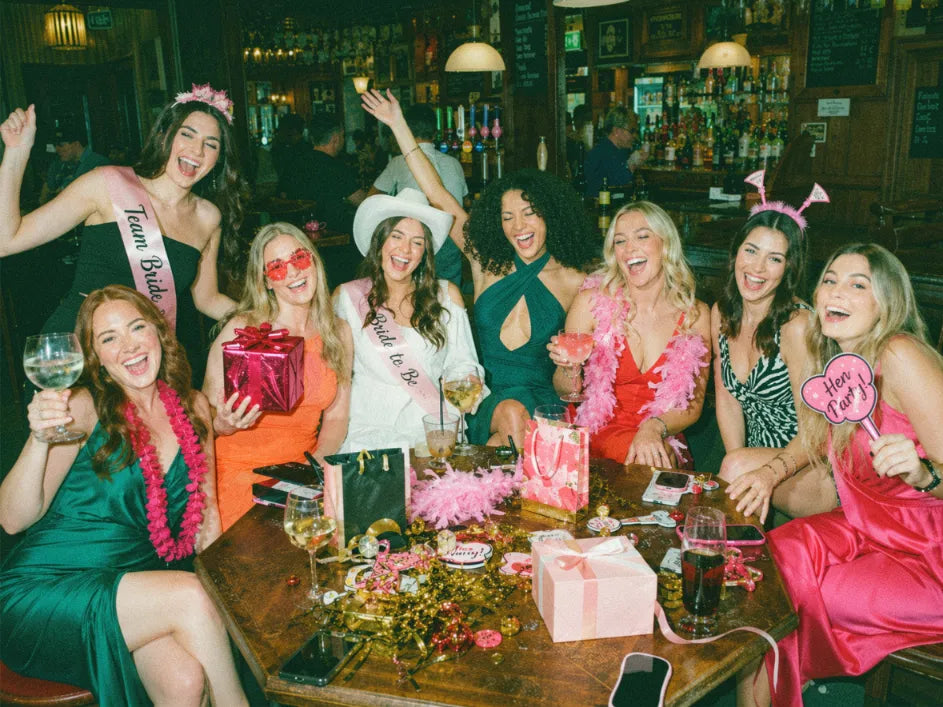 Group of friends celebrating a birthday on a pub golf night out