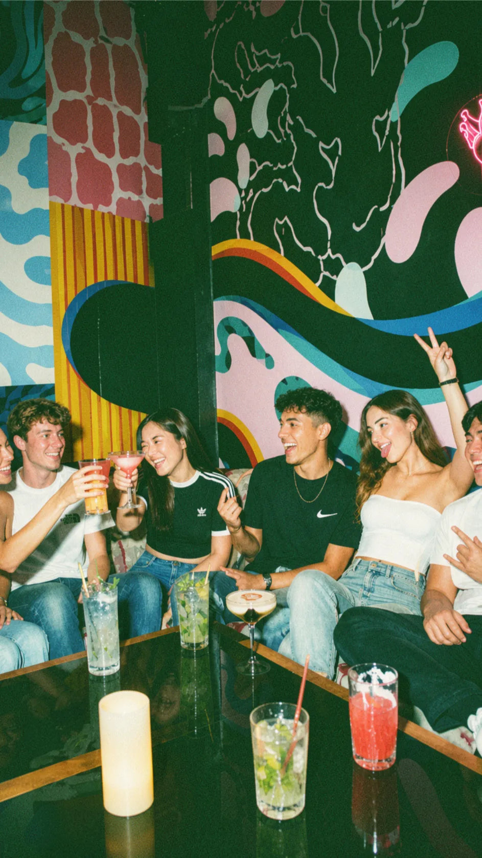 Group of friends on a student night out playing pub golf
