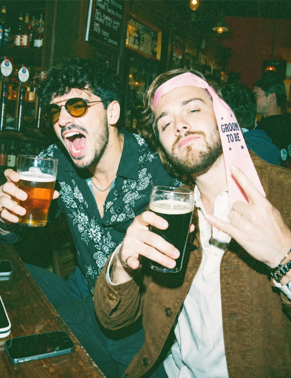 Mates celebrating a stag do on a pub golf night out