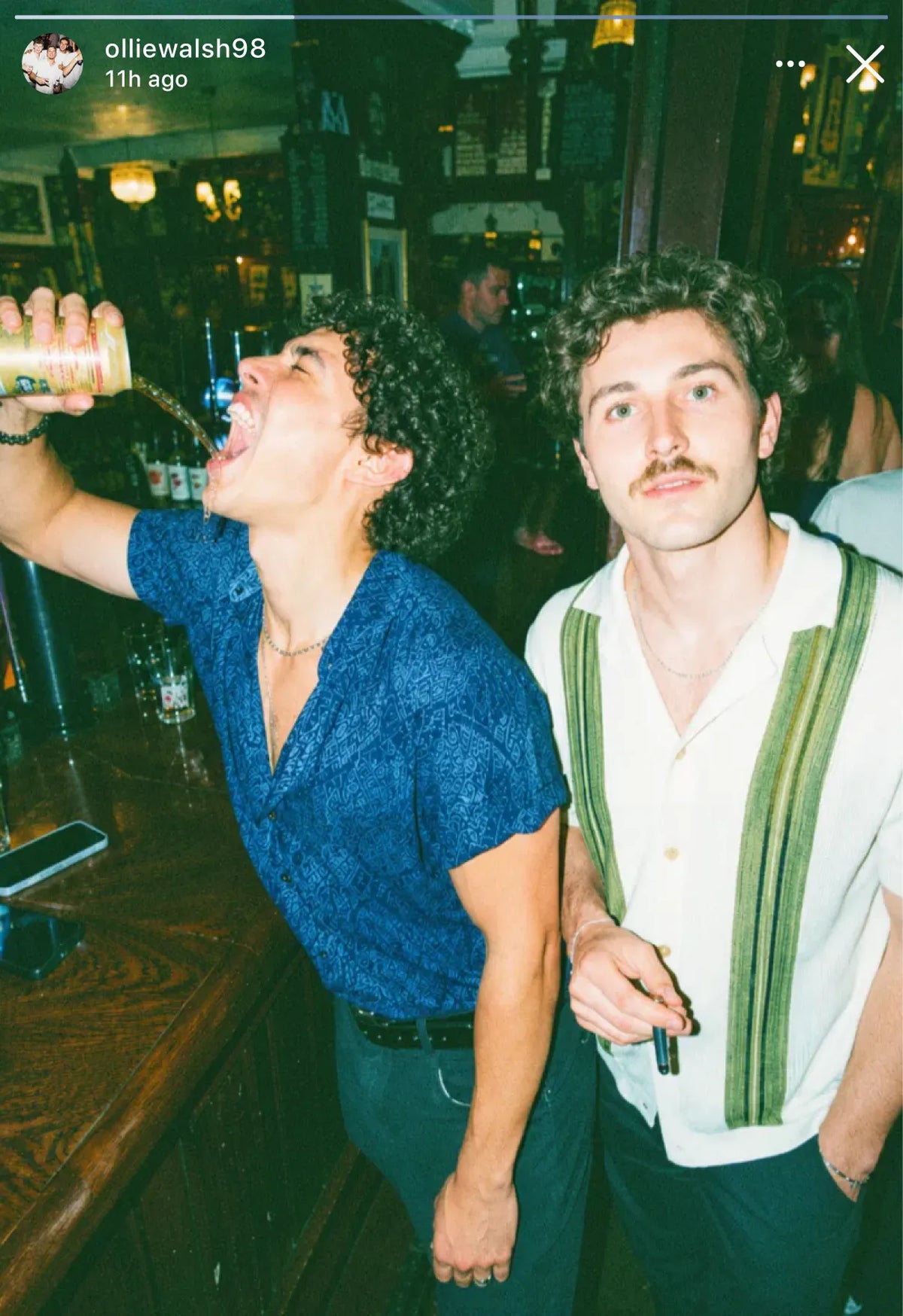 Instagram story of two friends larking about at the bar on a pub golf night out