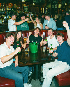 Pub golf team cheering and celebrating during a night out